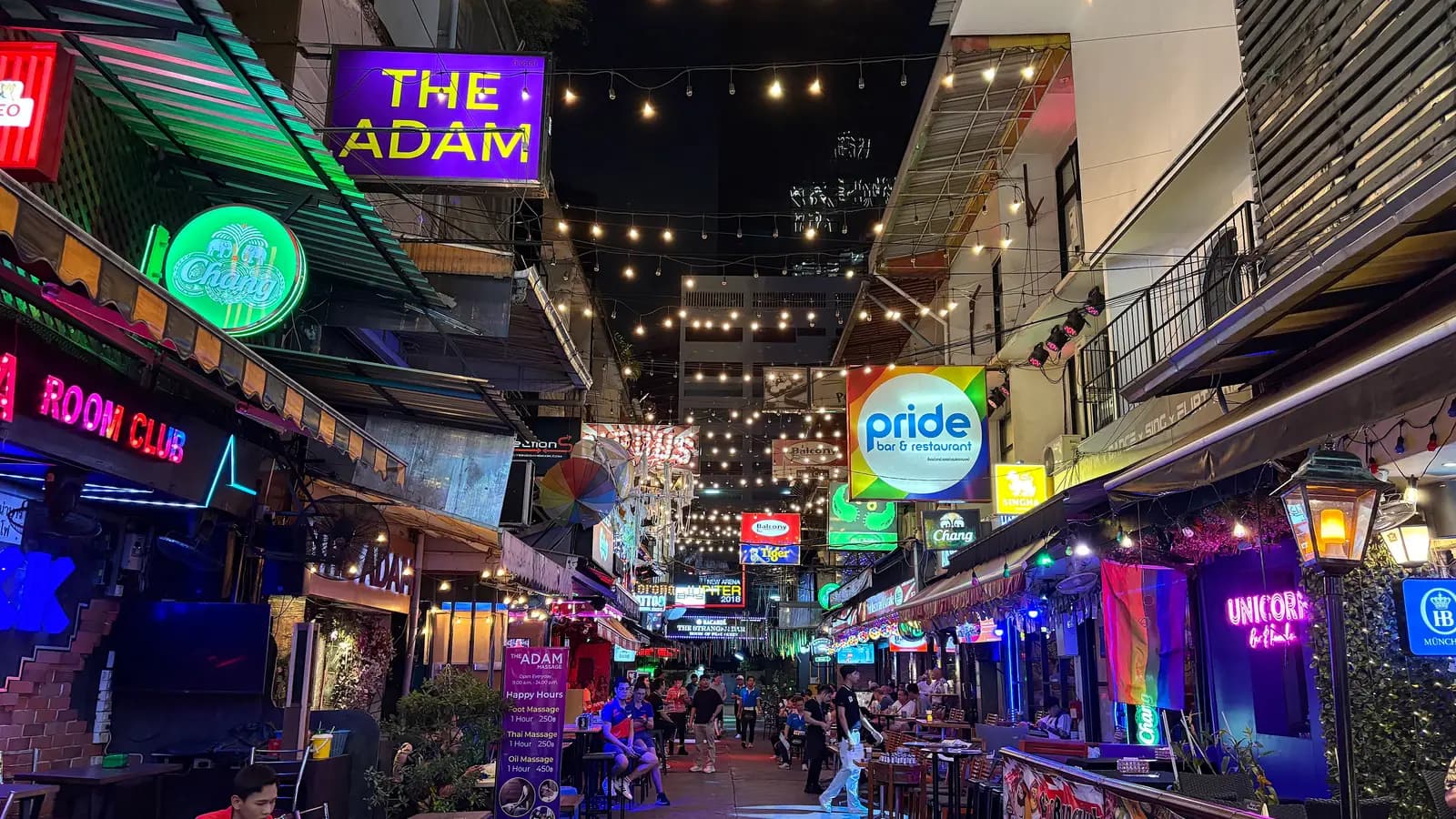 People at pavement bars along Silom Soi 4 at night