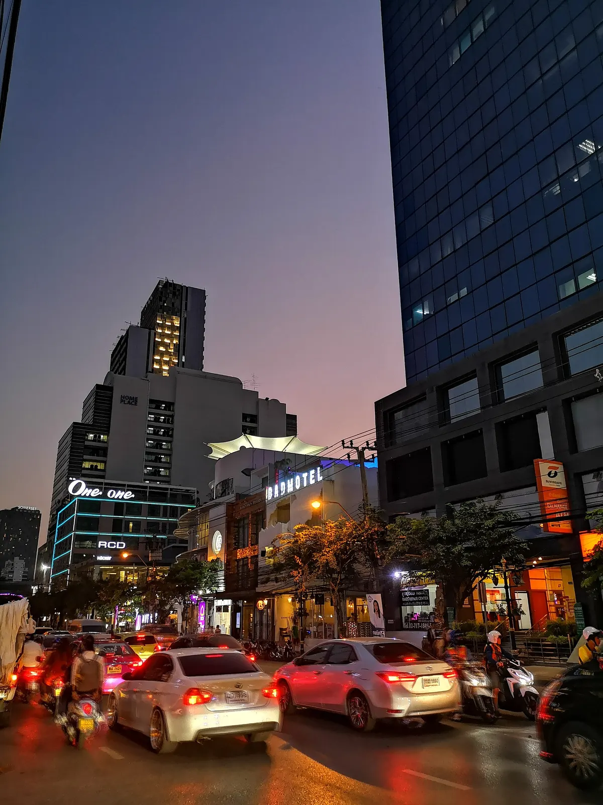 Traffic and towers on Thonglor at dusk
