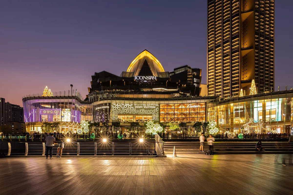 ICONSIAM lit up at night on the Chao Phraya