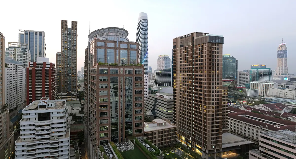 Evening light over the towers around Langsuan, seen from The Speakeasy at Hotel Muse