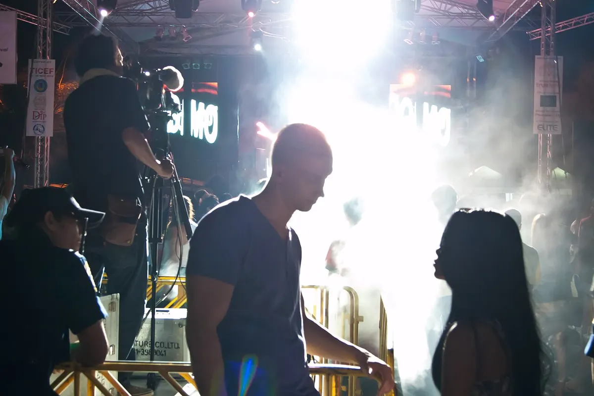 Festival-goers and stage lights at a past electronic music festival in Pattaya